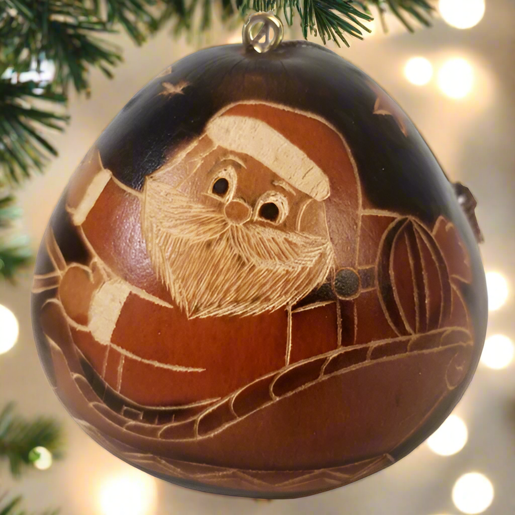 hand-carved and hand-painted gourd ornament in black red and white. Fair Trade ornament from Low Country Fair Trade