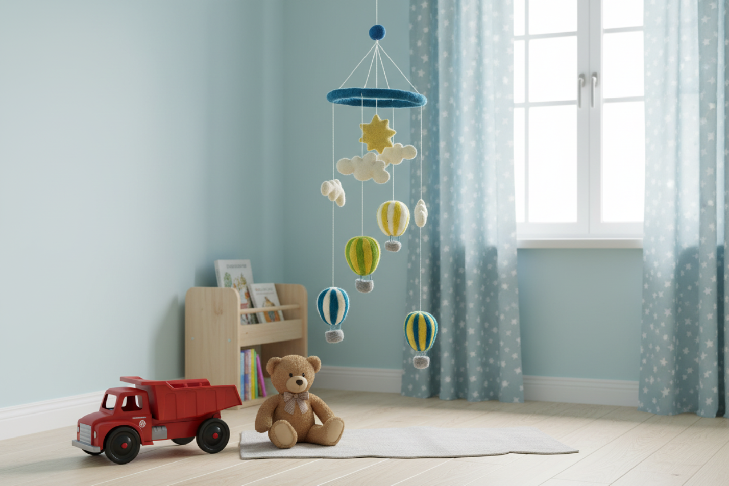 Children's room with a teddy bear, toy truck, and colorful mobile hanging from the ceiling.
