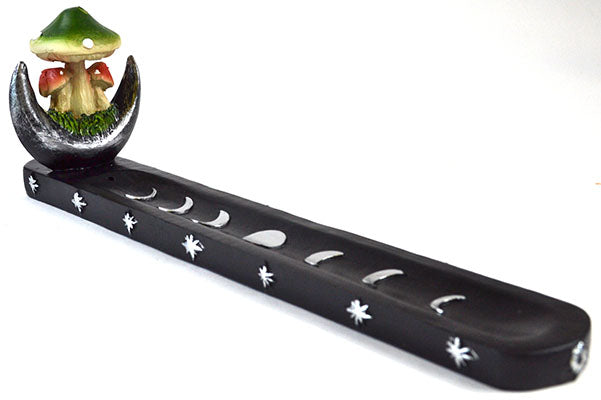 Decorative item with a mushroom figure on a crescent moon and phases of the moon display.