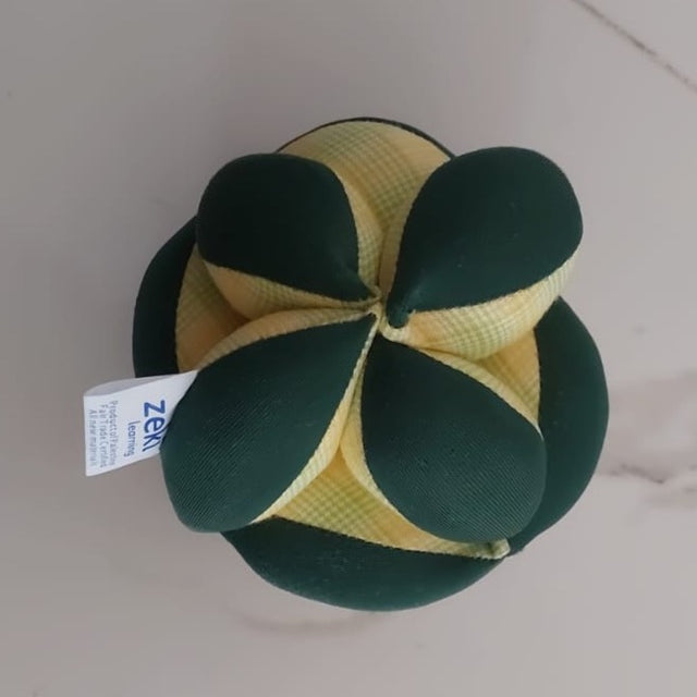 dark green and yellow plush soft puzzle ball for children by Zeki Learning