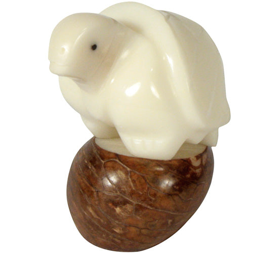 <center>Tricky Turtle Tagua Pet Figurine </br>Crafted by Artisans in Ecuador </br>Measures 2-1/4” high x 2” wide x 2” deep</center>