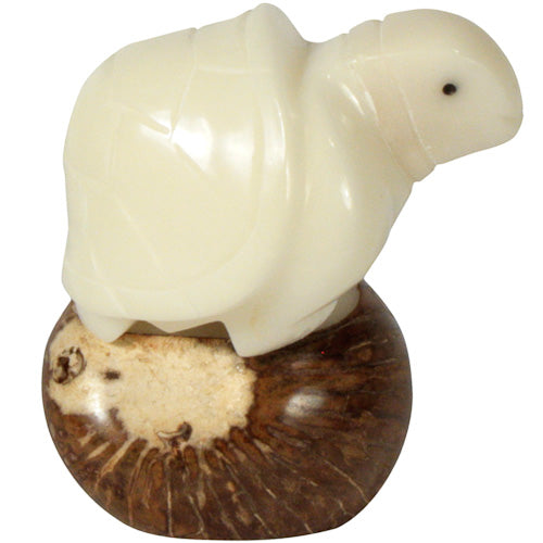 <center>Tricky Turtle Tagua Pet Figurine </br>Crafted by Artisans in Ecuador </br>Measures 2-1/4” high x 2” wide x 2” deep</center>