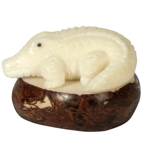 <center>Alligator Tagua Figurine </br>Crafted by Artisans in Ecuador </br>Measures 1-1/4” high x 1-3/4” wide x 2” long</center>