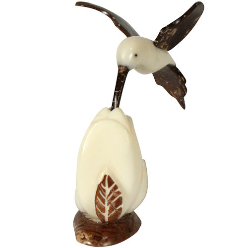 <center>Hummingbird Feeding Tagua Figurine with Coconut Wings - Front View </br>Crafted by Artisans in Ecuador </br>Measures 4-1/2” high x 2-1/2” wide x 3” deep</center>