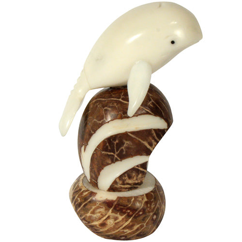 <center>Jumping Whale Tagua Figurine </br>Crafted by Artisans in Ecuador </br>Measures 3-1/2” high x 2” wide x 2” deep</center>