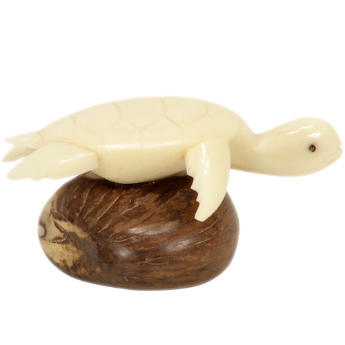 <center>Tagua Sea Turtle Figurine with Natural Shell - Side View</br> Carved by Artisans of Ecuador </br> Measures: 1-3/4” high x 2-1/4” wide x 2-3/4” deep</center>