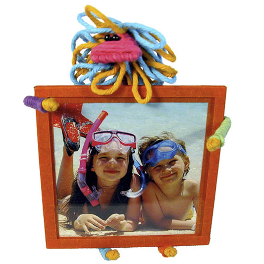 handmade square tabletop picture frame with handmade cute multi-colored Lion easel that holds the frame. Made form recycled wire and cotton, fair trade product at lowcountryfairtrade.com
