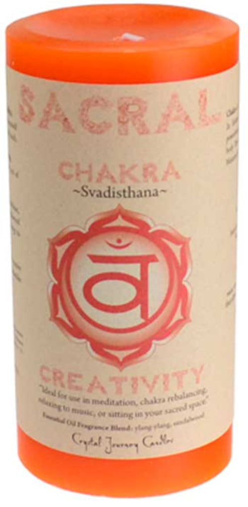 Candle with 'Sacral Chakra' and 'Creativity' text on a white background