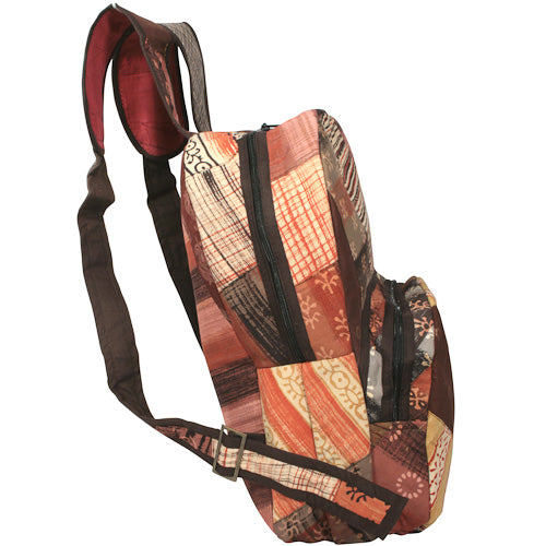 <center>Earth Tone Patchwork Backpack </br>Crafted by Artisans in India </br>Measures 17” high x 12-1/2” wide x 6-1/2” deep</center>